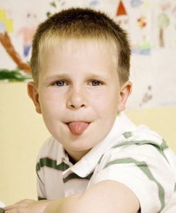 Kid Sticking Tongue Out At Teacher